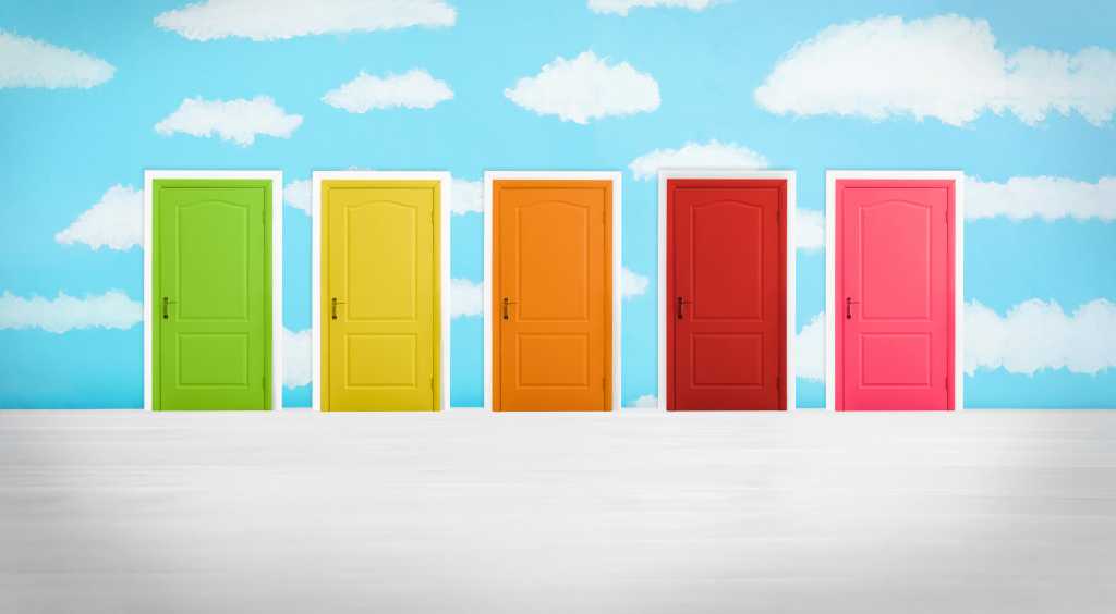 Many colorful doors in a room. Concept of choice. Green, yellow, orange, red, and pink doors on a brushed silver foreground and painted bright blue and white cloud background.