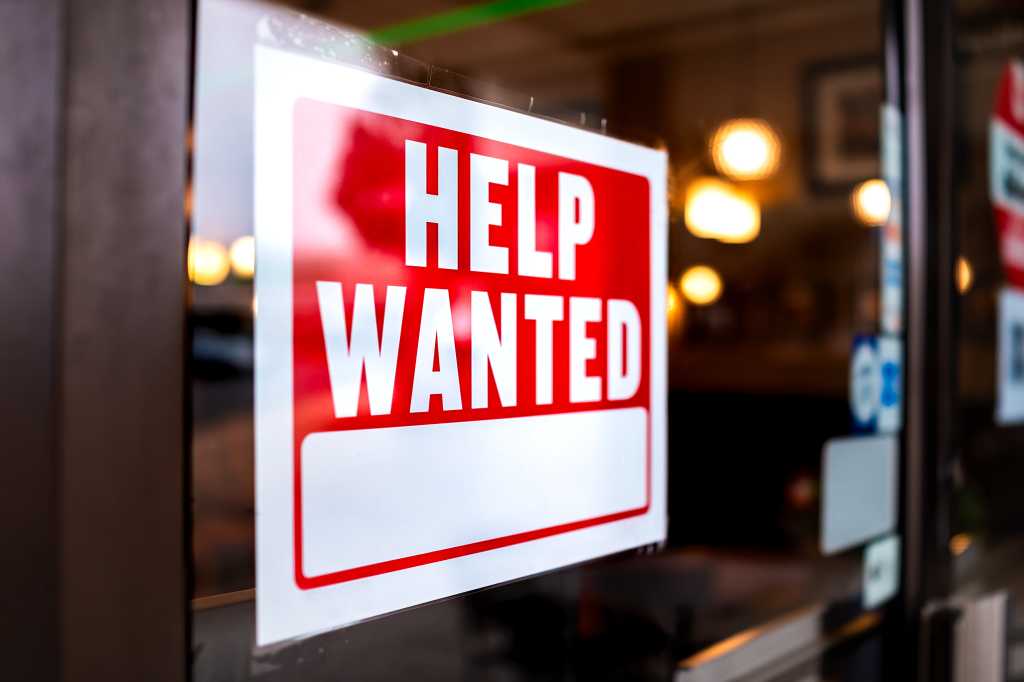 shutterstock 1840085851 help wanted sign in office window