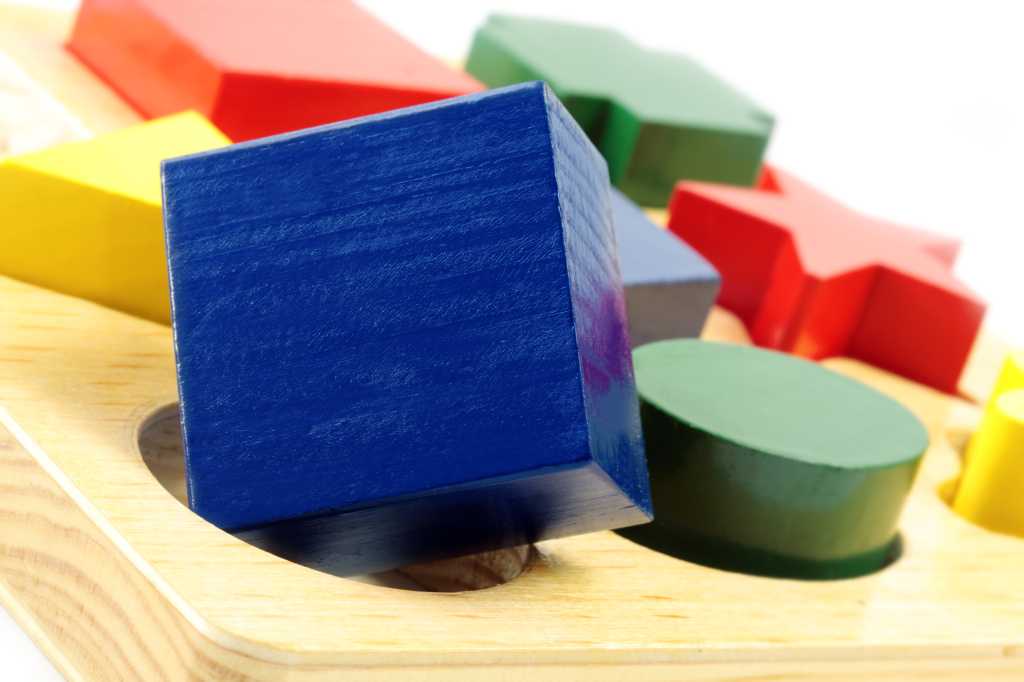 square peg in a round hole, blue green yellow red blocks