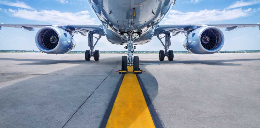 shutterstock 637037008 underside of jet aircraft and jet turbines on runway