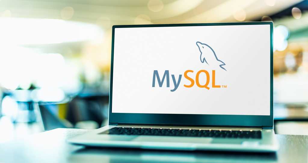 shutterstock 1932493496 laptop computer displaying logo of MySQL open source database