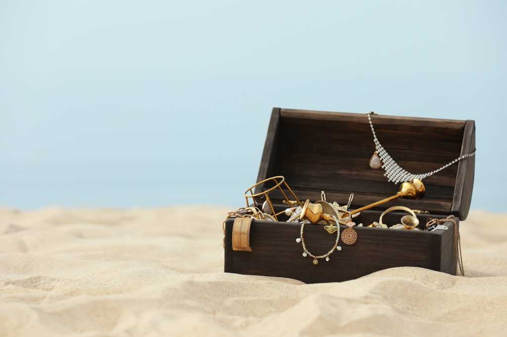 Treasure chest on a sandy beach.